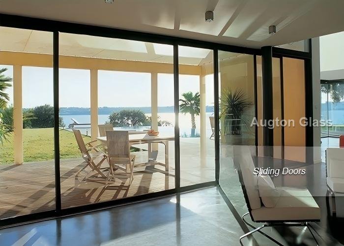 Ground-floor glazing on a storefront grid: framing stops where structural demand begins.